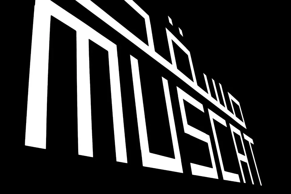 Large white lettering spells Muscat against a deep black background.